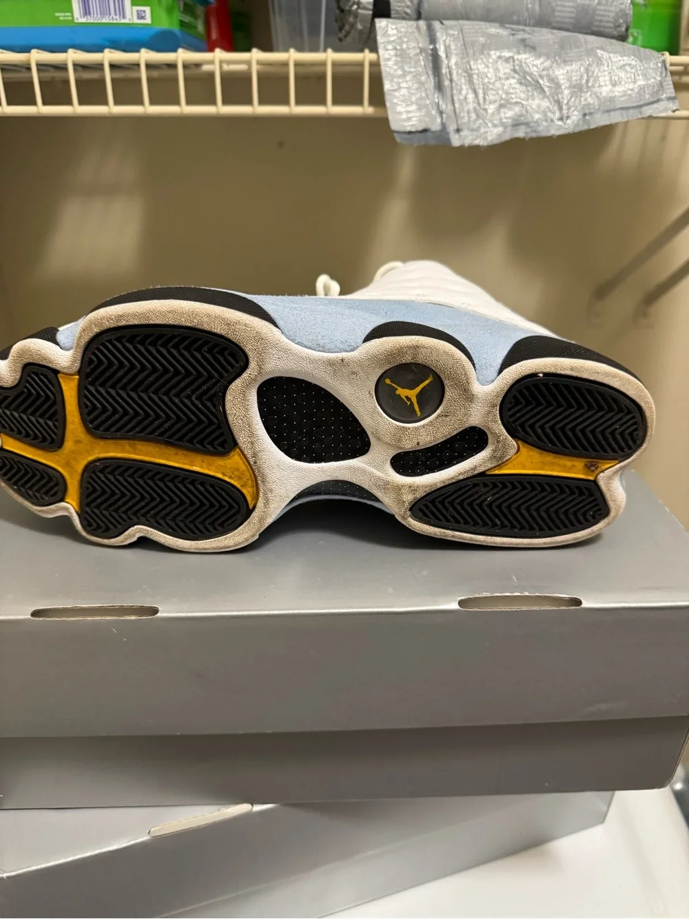 Jordan Men’s White Athletic Shoes with Black and Gold Accents